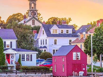 A small town harbor from the water at sunrise